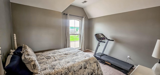 carpeted bedroom featuring baseboards, vaulted ceiling, and visible vents