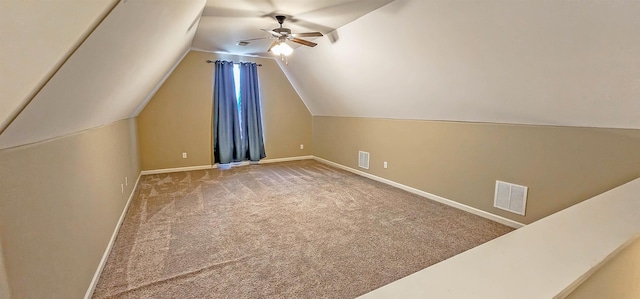 additional living space featuring baseboards, a ceiling fan, carpet floors, and visible vents
