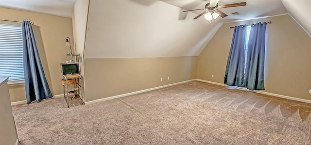 additional living space featuring carpet floors, ceiling fan, visible vents, and lofted ceiling