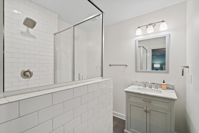 bathroom with vanity and a stall shower