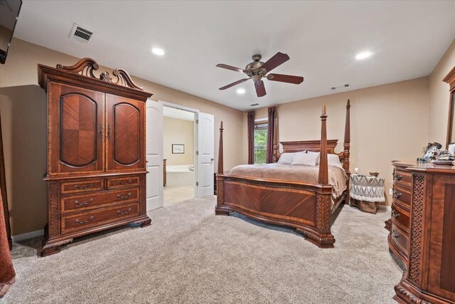 carpeted bedroom featuring ceiling fan, recessed lighting, ensuite bath, and visible vents