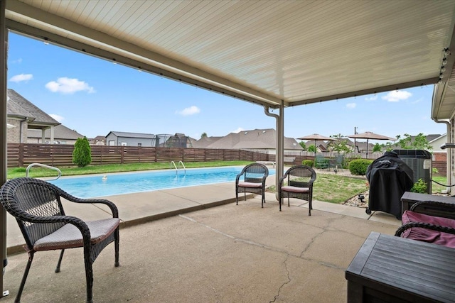 view of swimming pool featuring a fenced backyard, a fenced in pool, a patio, and a residential view