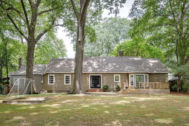 3537 Oakley Ave, Memphis, TN 38111 - rear view of house with a wooden deck, a yard, and a chimney