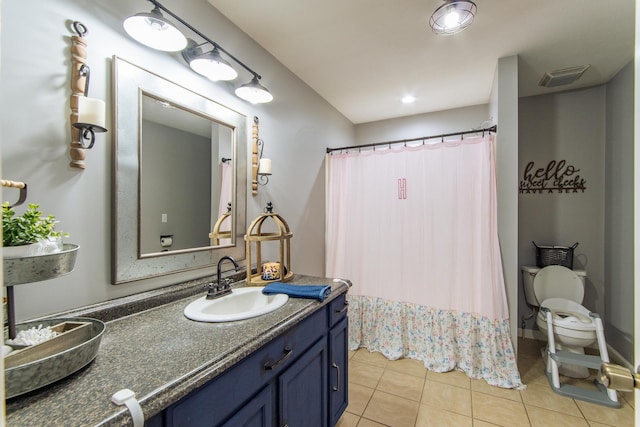 full bathroom featuring visible vents, curtained shower, tile patterned flooring, and vanity