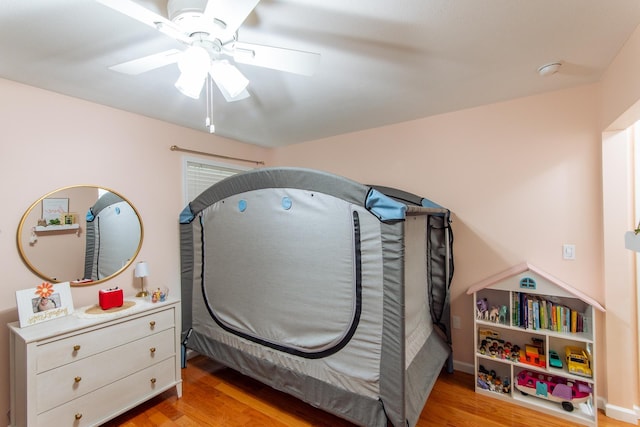 bedroom featuring light wood-style floors and ceiling fan