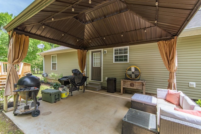 view of patio / terrace with an outdoor living space, a grill, a gazebo, and entry steps
