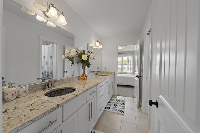 full bathroom with a sink, tile patterned flooring, and double vanity