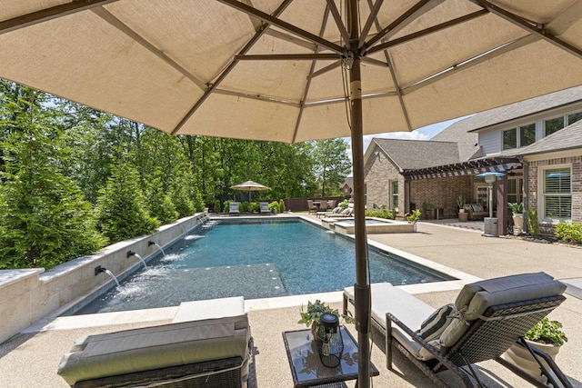 view of swimming pool with a patio, a pool with connected hot tub, and a pergola