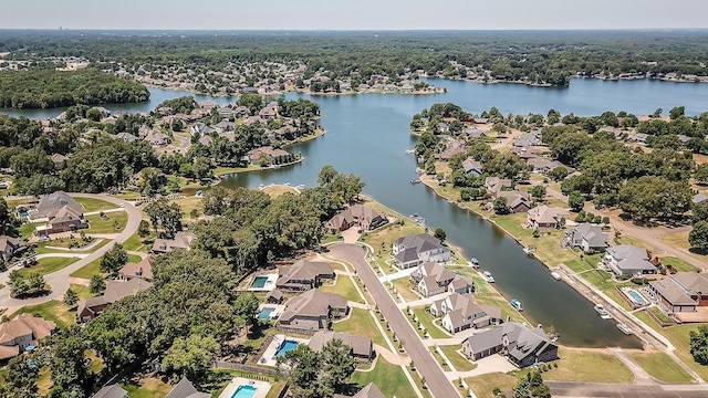 birds eye view of property with a water view and a residential view