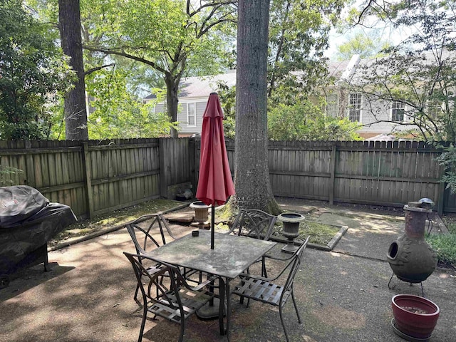 6905 Petworth Rd Unit 6905, Memphis, TN 38119 - view of patio / terrace with a fenced backyard, outdoor dining space, and a grill