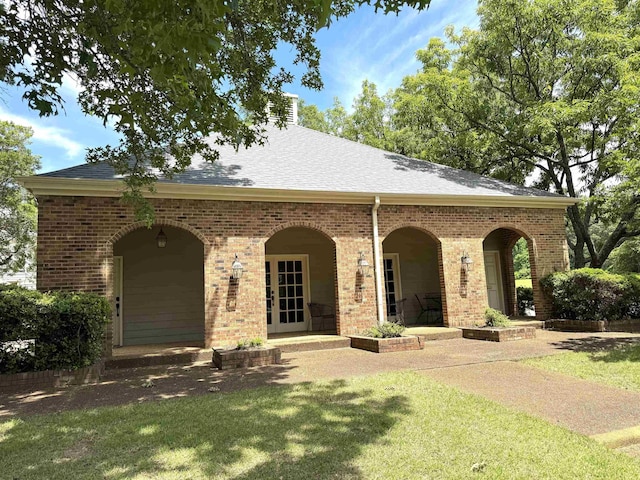 6905 Petworth Rd Unit 6905, Memphis, TN 38119 - view of front of home featuring brick siding, a front lawn, and a shingled roof