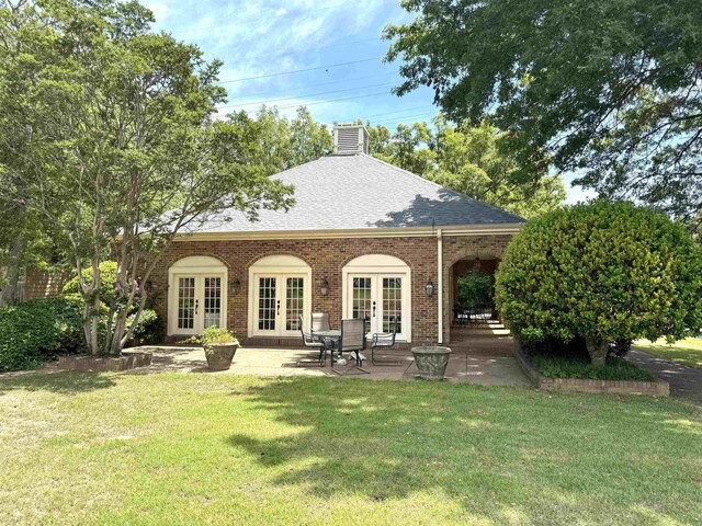 6905 Petworth Rd Unit 6905, Memphis, TN 38119 - rear view of property with french doors, a lawn, a chimney, and a shingled roof