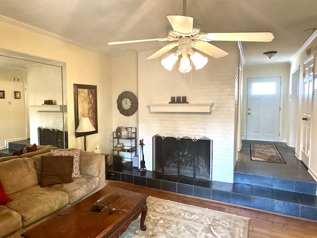 6905 Petworth Rd Unit 6905, Memphis, TN 38119 - living room featuring wood finished floors, ceiling fan, crown molding, and a fireplace