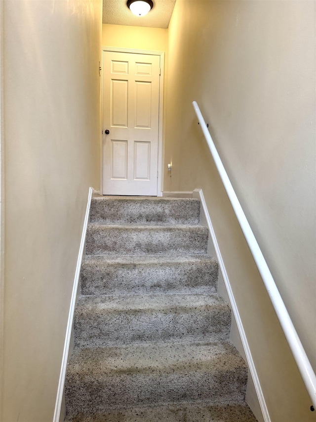 6905 Petworth Rd Unit 6905, Memphis, TN 38119 - stairs featuring baseboards and carpet
