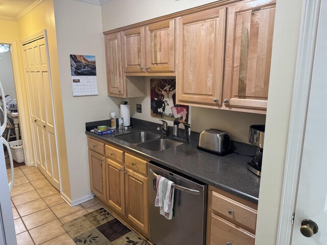6905 Petworth Rd Unit 6905, Memphis, TN 38119 - kitchen featuring stainless steel dishwasher, a sink, crown molding, dark countertops, and light tile patterned floors