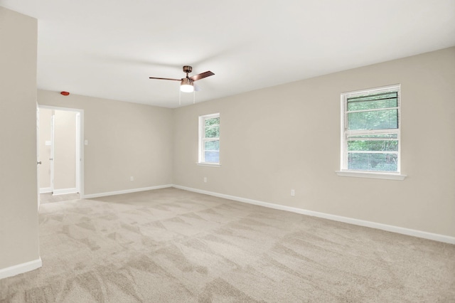 1296 Monasco Rd, Millington, TN 38053 - unfurnished room featuring light colored carpet, baseboards, and ceiling fan