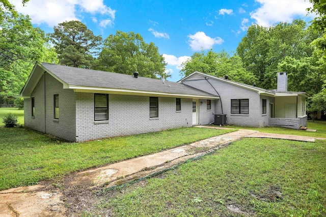 1296 Monasco Rd, Millington, TN 38053 - ranch-style house with central AC unit, a chimney, a front lawn, and brick siding