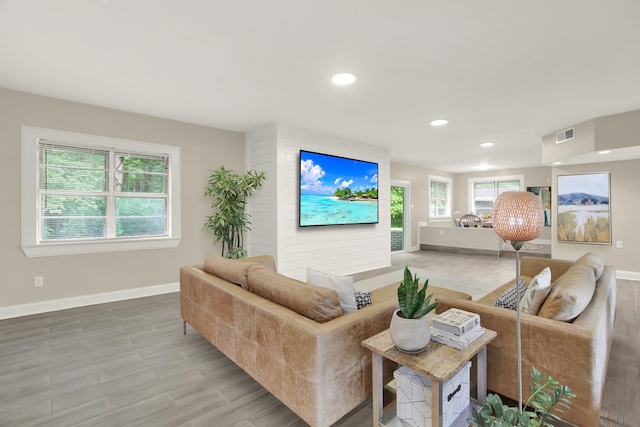 1296 Monasco Rd, Millington, TN 38053 - living room featuring baseboards, recessed lighting, wood finished floors, and visible vents