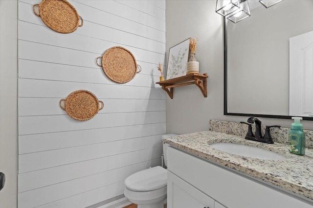 half bath with vanity and toilet