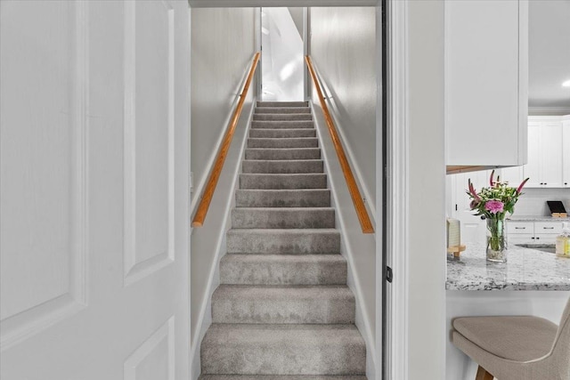 staircase with carpet floors