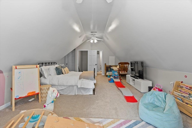 carpeted bedroom with a ceiling fan and lofted ceiling