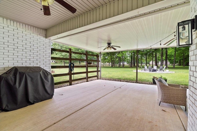 view of patio / terrace with ceiling fan and a grill