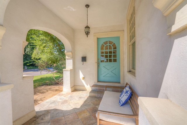 property entrance featuring stucco siding