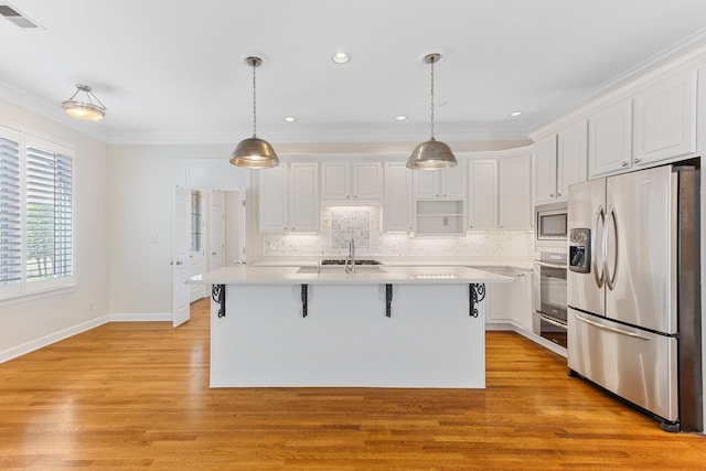 7298 Mont Blanc Dr, Germantown, TN 38138 - kitchen featuring stainless steel appliances, visible vents, white cabinetry, and a sink