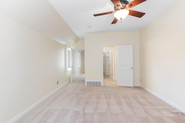 7298 Mont Blanc Dr, Germantown, TN 38138 - unfurnished bedroom featuring light colored carpet, a ceiling fan, baseboards, a spacious closet, and visible vents