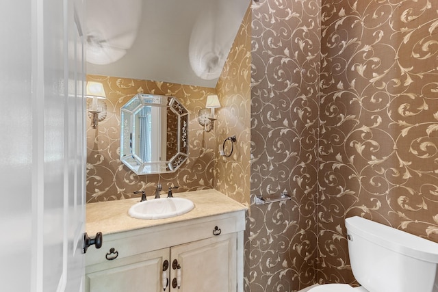 7298 Mont Blanc Dr, Germantown, TN 38138 - bathroom with vanity, toilet, and wallpapered walls