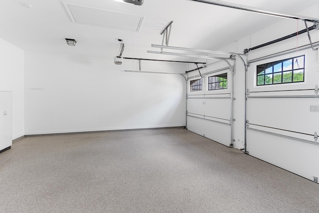 7298 Mont Blanc Dr, Germantown, TN 38138 - garage featuring baseboards and a garage door opener