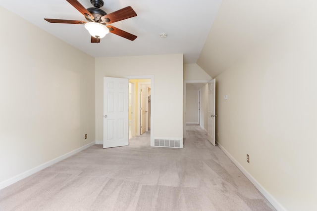 7298 Mont Blanc Dr, Germantown, TN 38138 - unfurnished bedroom with baseboards, light carpet, vaulted ceiling, and visible vents
