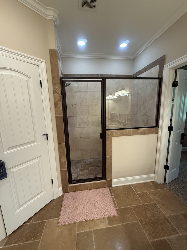 bathroom with crown molding, recessed lighting, and a stall shower
