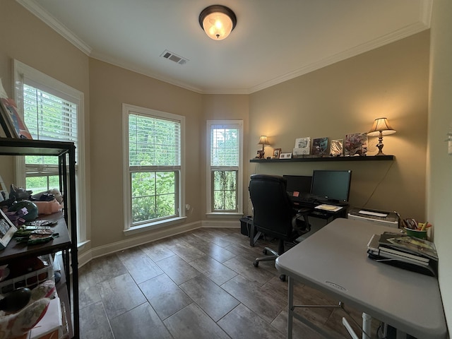 office area with visible vents, baseboards, and crown molding