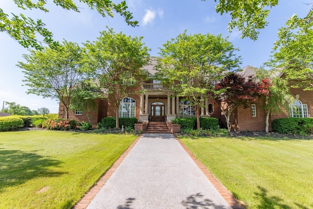 4265 Charlie Pounds Rd, Stantonville, TN 38379 - view of front of property with brick siding and a front yard
