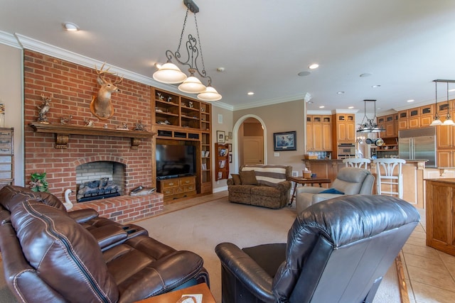 4265 Charlie Pounds Rd, Stantonville, TN 38379 - living room with ornamental molding, a brick fireplace, recessed lighting, built in shelves, and arched walkways