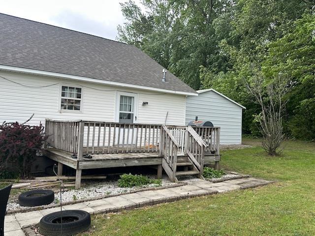 85 Two Boys Rd, Savannah, TN 38372 - back of property with roof with shingles, a lawn, and a wooden deck
