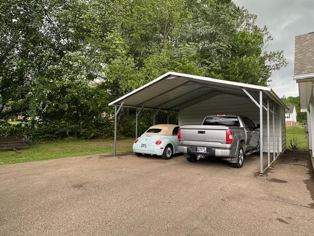 85 Two Boys Rd, Savannah, TN 38372 - view of vehicle parking with driveway and a detached carport