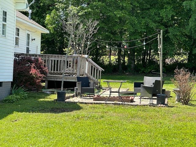 85 Two Boys Rd, Savannah, TN 38372 - view of grassy yard with a wooden deck