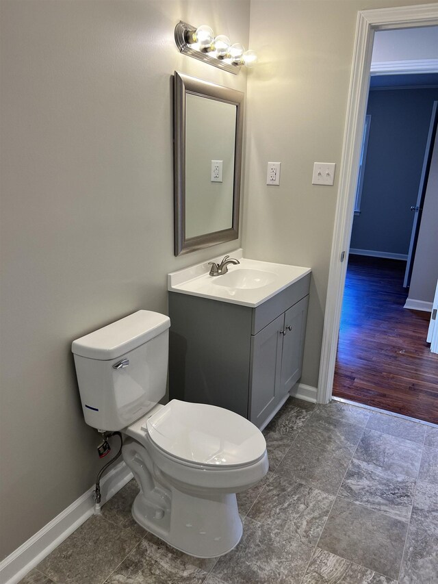 410 Pinhook Dr, Savannah, TN 38372 - bathroom with baseboards, vanity, and toilet