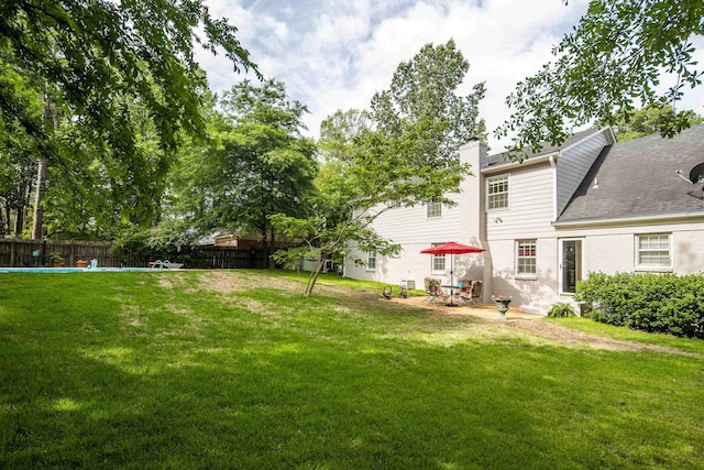 view of yard with fence and a patio area
