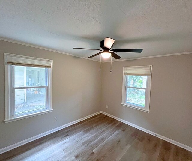 4485 Dunn Rd, Memphis, TN 38117 - empty room with crown molding, a ceiling fan, baseboards, and wood finished floors