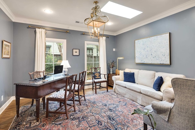 home office featuring crown molding, a skylight, visible vents, and wood finished floors