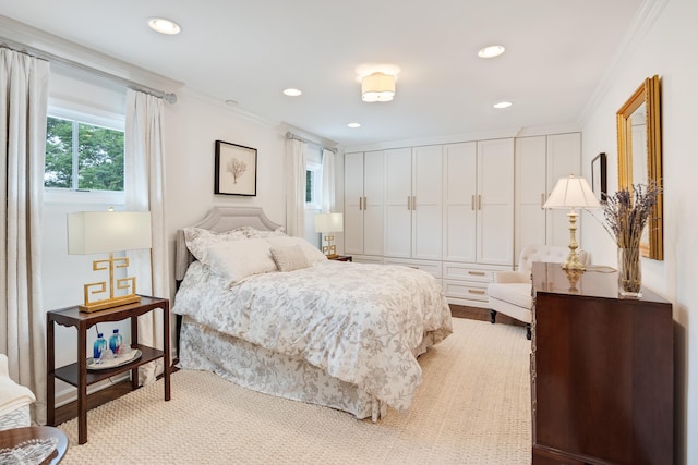 bedroom with crown molding, recessed lighting, and multiple windows