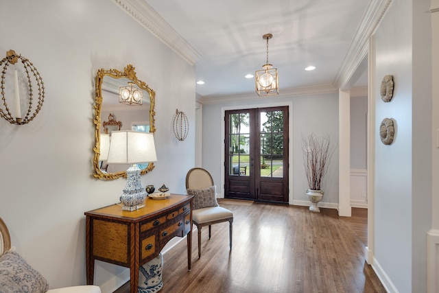 foyer entrance with baseboards, ornamental molding, recessed lighting, and wood finished floors