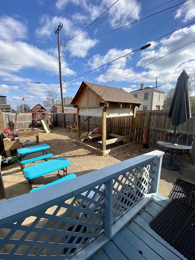 exterior space featuring a fenced backyard and a playground