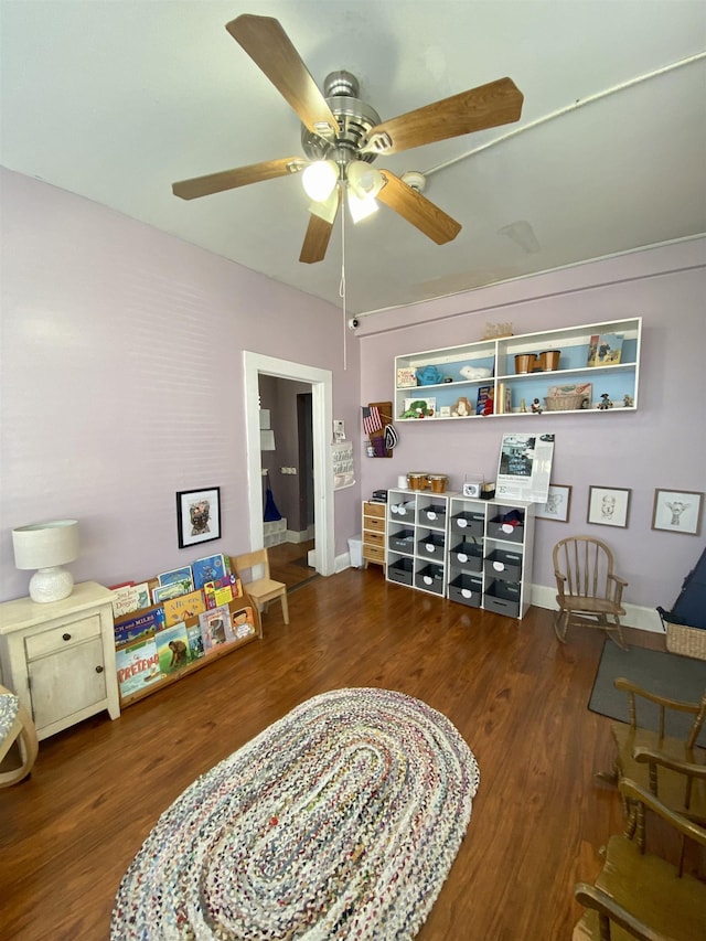 rec room with ceiling fan and wood finished floors