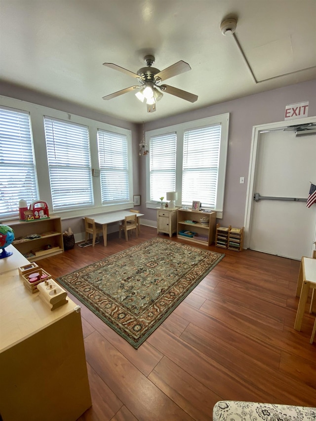 interior space featuring a ceiling fan and wood finished floors