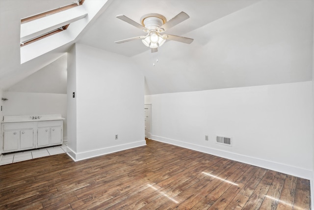2009 Linden Ave, Memphis, TN 38104 - bonus room with visible vents, baseboards, ceiling fan, light wood-type flooring, and vaulted ceiling with skylight