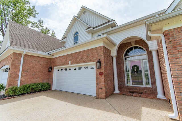 164B Aquaticview Way, Savannah, TN 38372 - exterior space featuring brick siding, driveway, and roof with shingles